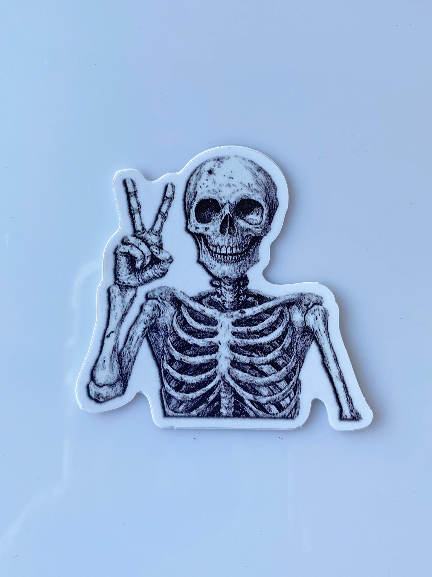 Skeleton Peace Sign Sticker – Spooky 2" Vinyl with Attitude from Beyond the Grave – Goth, Oddity, Paranormal & Alt Vibes