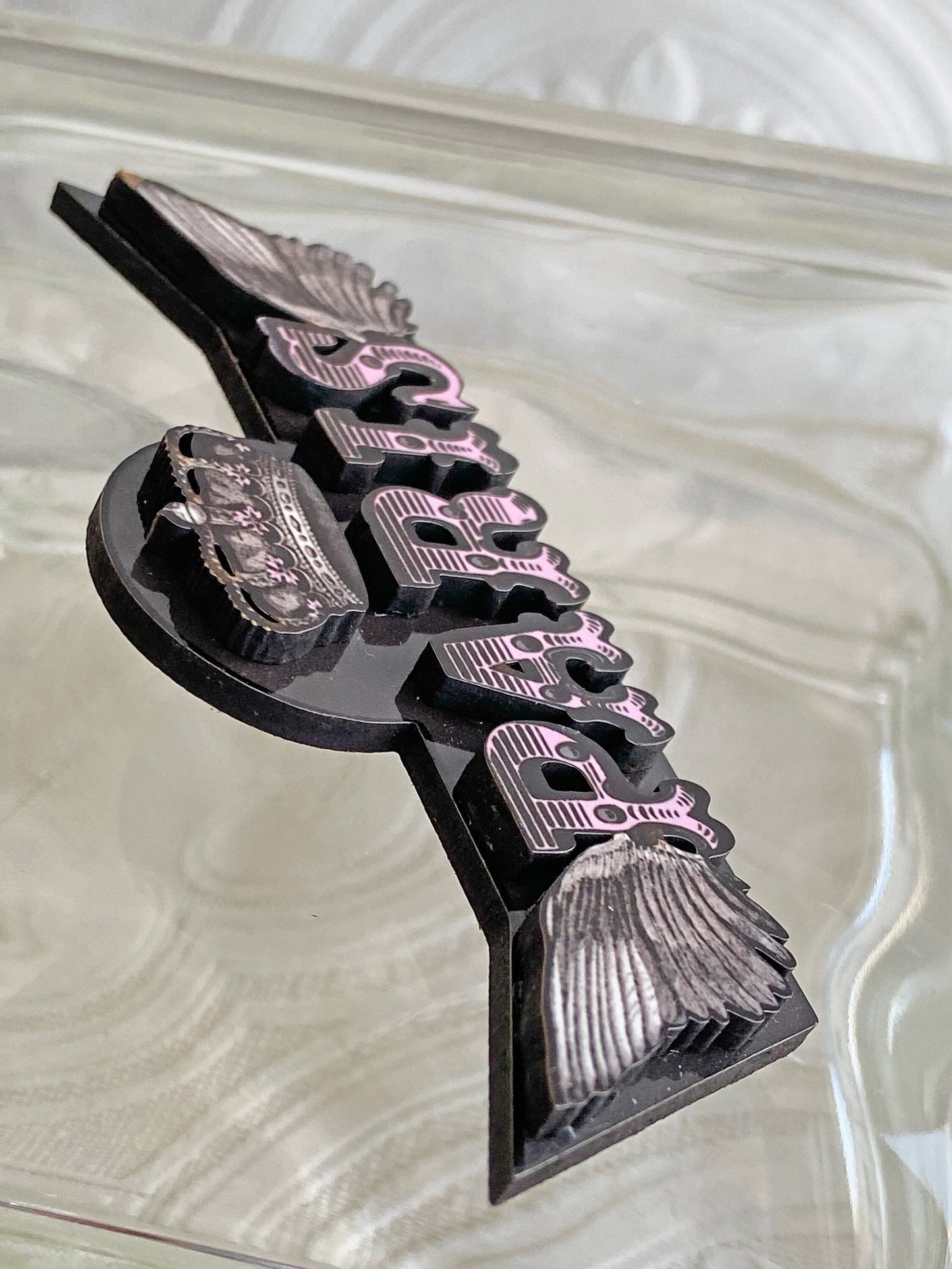 Beautiful Paris Handcrafted Brooch ~ Pink and Black ~ The Letters of Paris are articulated in laser-cut wood with sublimated images.