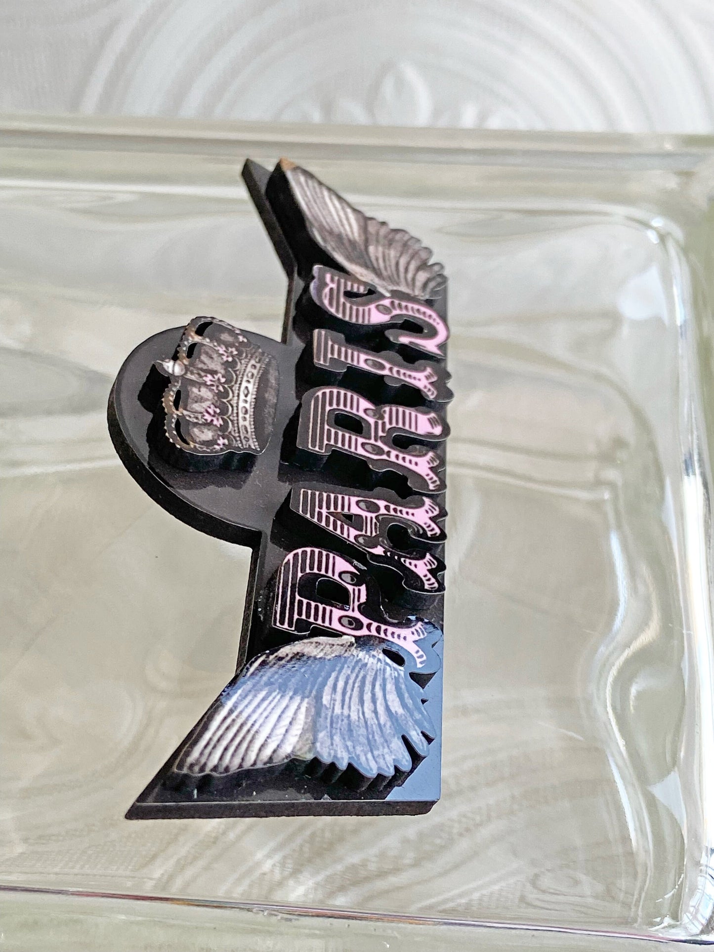 Beautiful Paris Handcrafted Brooch ~ Pink and Black ~ The Letters of Paris are articulated in laser-cut wood with sublimated images.
